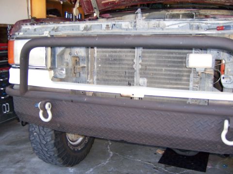1991 Ford Bronco - Close-up of a truck's front end, an aftermarket bumper and exposed radiator.