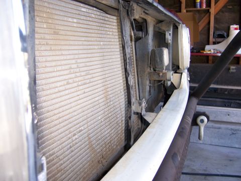 1991 Ford Bronco - Close-up view of a vehicle's radiator and front bumper assembly.