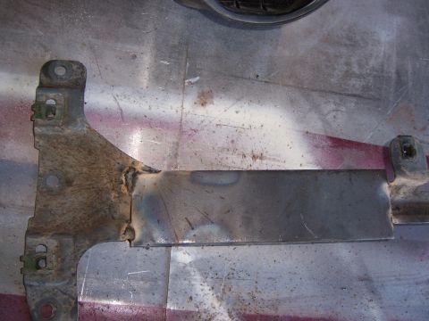 1991 Ford Bronco - This is a welded metal bracket, likely a replacement part, showing signs of rust and modification.