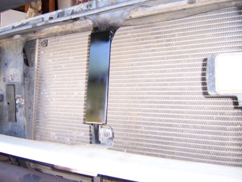 1991 Ford Bronco - The front of a vehicle's cooling system, showing the radiator and a transmission cooler, is visible.