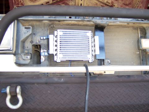 1991 Ford Bronco - Aftermarket transmission cooler installed in front of the vehicle's main radiator.
