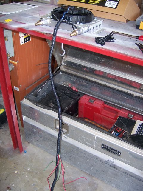 1991 Ford Bronco - Transmission cooler assembly with fan and wiring, ready for installation.