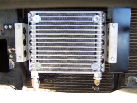 1991 Ford Bronco - Aftermarket transmission cooler installed in front of the vehicle's main radiator.