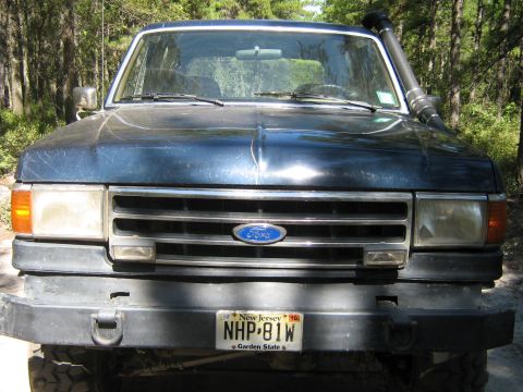 1990 Ford Bronco - Front view of a dark blue 1990 Ford Bronco, equipped with a snorkel and a New Jersey license plate.
