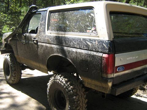 1990 Ford Bronco - This heavily modified 1990 Ford Bronco is covered in mud, a snorkel and off-road tires.
