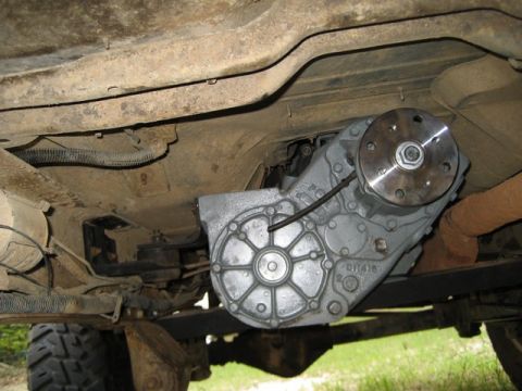 1995 Ford Bronco - Close-up of the vehicle's transfer case, showing its mechanical components and connections.
