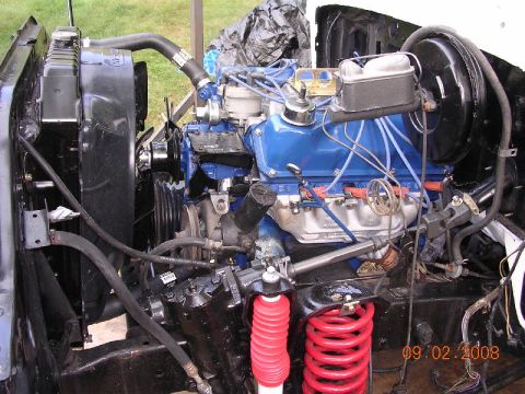 1978 Ford Bronco - Close-up view of an engine bay showing the V8 engine, radiator, and suspension components.