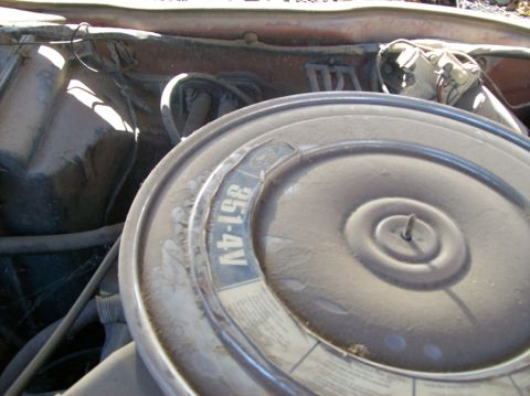 1975 Ford Ranchero - The air cleaner lid shows the Ford logo and '351-4V' designation.