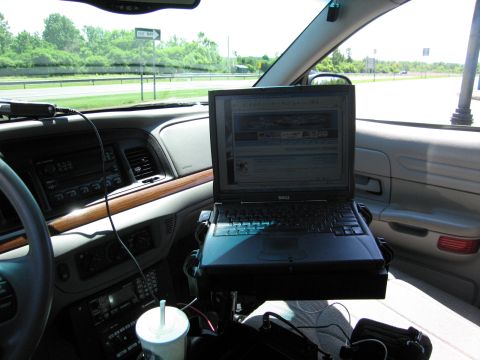 2001 Ford Crown Victoria - Interior view of a 2001 Ford Crown Victoria equipped with a laptop and police radio.