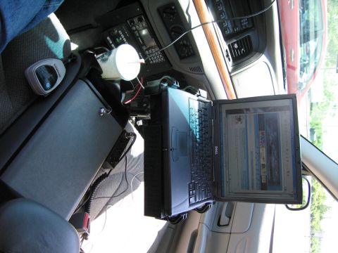 2001 Ford Crown Victoria - The interior of a police vehicle is equipped with a laptop and radio for duty.