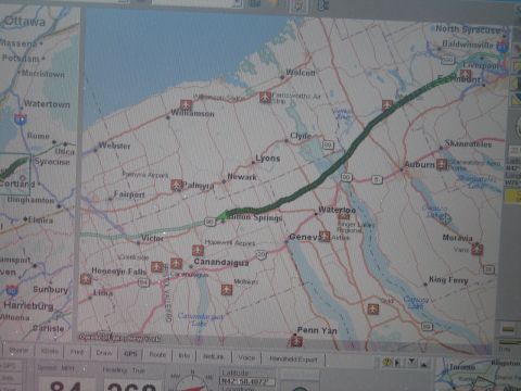 2001 Ford Crown Victoria - A GPS navigation system displays a map of New York State, showing a route and various locations.