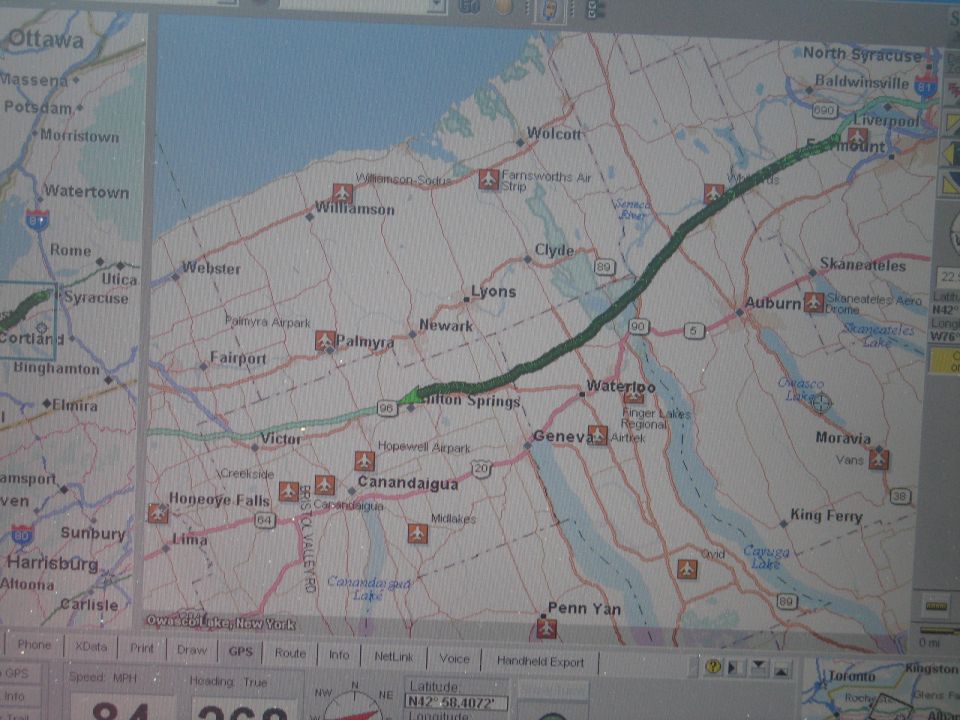 GPS screen displays a map of New York with a highlighted route. Speed and GPS data are visible at the bottom