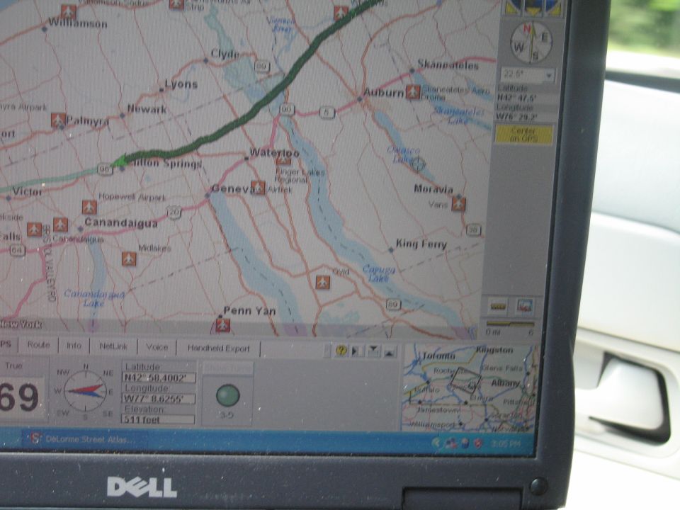 Laptop screen showing a DeLorme GPS street-atlas map of New York