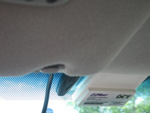 2001 Ford Crown Victoria - Interior view of a vehicle's windshield showing an E-ZPass transponder and a DCT sticker.