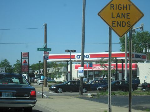 2001 Ford Crown Victoria - A street scene shows multiple cars near a Citgo gas station under a bright blue sky.