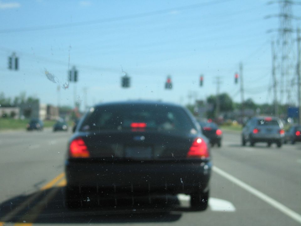 Black 2001 Ford Crown Victoria rear view on a sunny day
