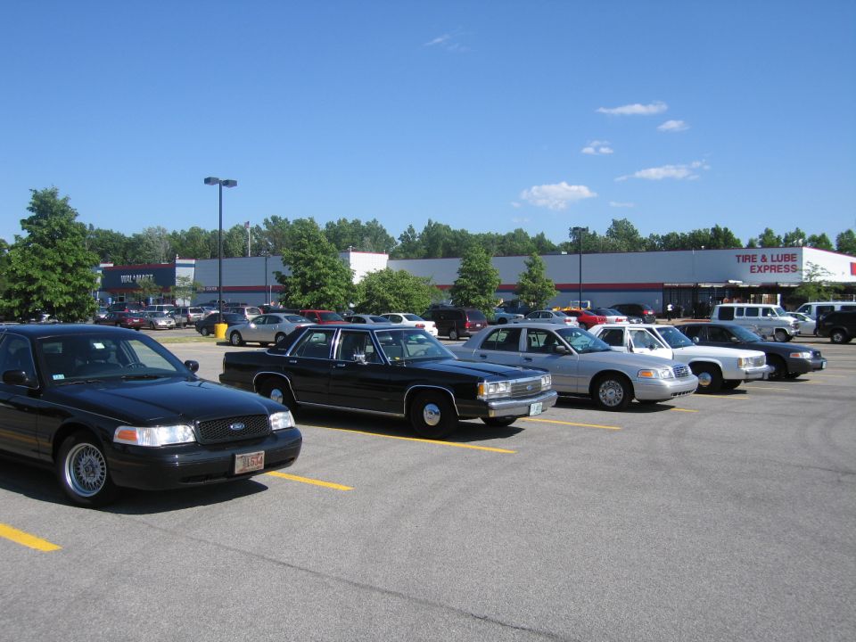 Black 2001 Ford Crown Victoria, 3q-front view, parked in a lot