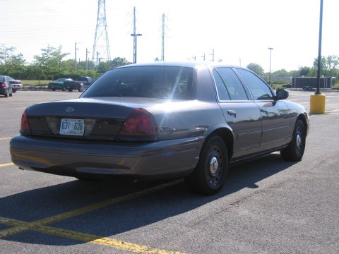2001 Ford Crown Victoria - Rear view of a 2001 Ford Crown Victoria sedan parked in a lot.