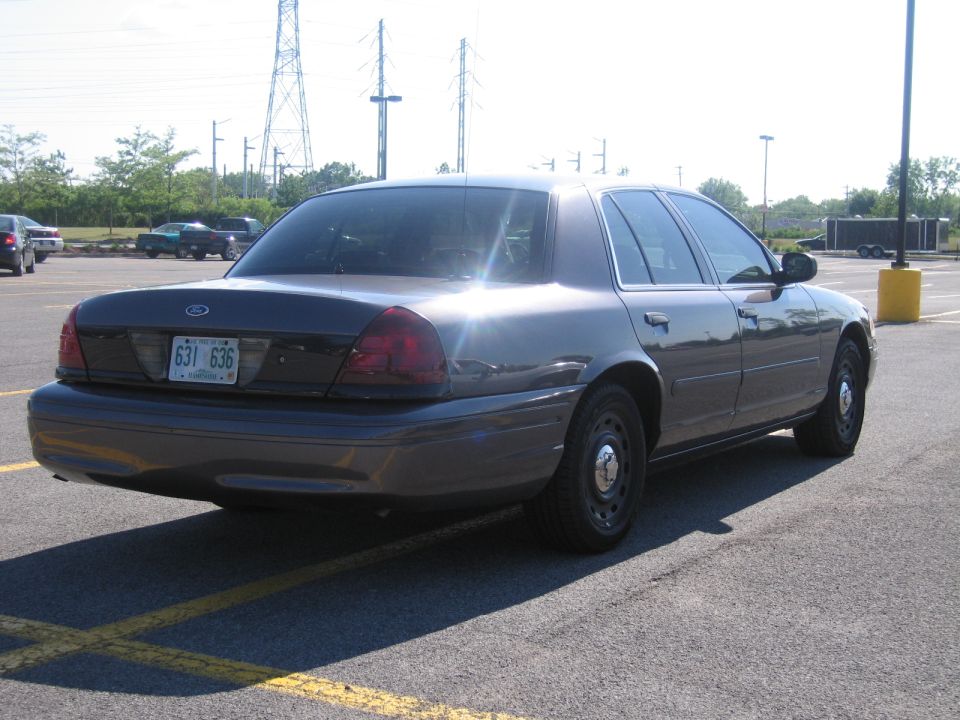2001 Ford Crown Victoria sedan, rear view, parked in a lot