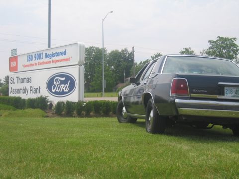 2001 Ford Crown Victoria - A dark 2001 Ford Crown Victoria is parked on the lawn in front of the St. Thomas Ford Assembly Plant.
