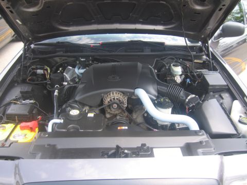 2001 Ford Crown Victoria - Engine bay of a 2001 Ford Crown Victoria, viewed from above with the hood raised.