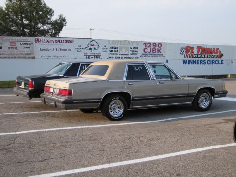 2001 Ford Crown Victoria - Photo of a tan Mercury sedan parked at the St. Thomas Dragway winners circle.