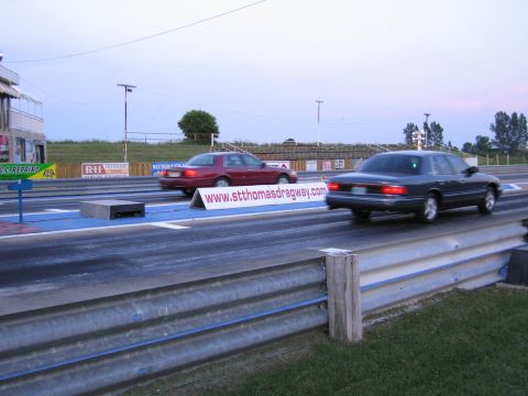 2001 Ford Crown Victoria - Photograph of cars racing at St. Thomas dragway, not a technical document.