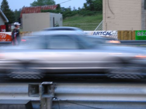 2001 Ford Crown Victoria - Blurred action photograph of cars racing at a dragstrip, not a technical document.