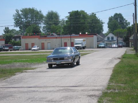 2001 Ford Crown Victoria - Photo of a blue Ford LTD Crown Victoria sedan on a residential street, not a technical document.