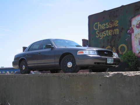 2001 Ford Crown Victoria - Photograph of a gray Ford Crown Victoria sedan, not a technical document.