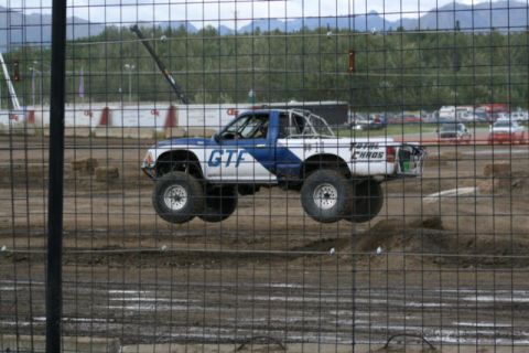 1975 Toyota Land Cruiser - Modified pickup truck jumps during an event at a dirt track.