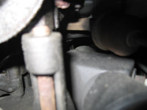 1991 Ford LTD Crown Victoria - Undercarriage view of engine components, showing mechanical details.