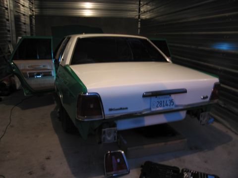 1991 Ford LTD Crown Victoria - Rear view of a 1991 Ford Crown Victoria LTD in a garage, doors open.