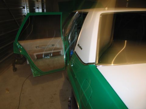1991 Ford LTD Crown Victoria - The interior of a 1991 Ford Crown Victoria LTD is visible with the driver's door open.