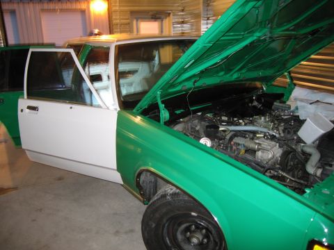 1991 Ford LTD Crown Victoria - This 1991 Ford Crown Victoria LTD is in a garage with its hood open, revealing the engine.