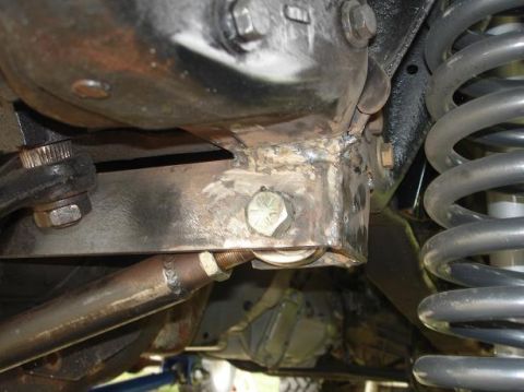 1996 Ford F-150 - Underside view of a vehicle's suspension system, showing custom welding on the frame.