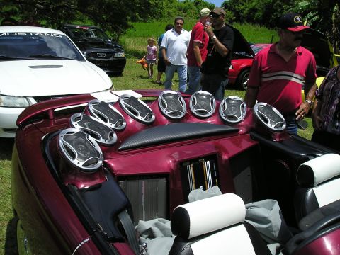 2009 Ford Mustang - A customized car interior is on display with numerous speakers and amplifiers.