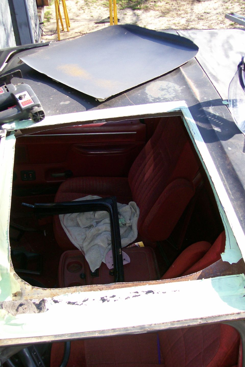What it looks like.  I left the roof section that the door seals against to determine dimensions for the lexan.