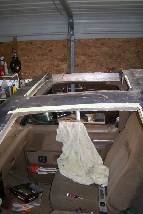 1988 Ford Bronco - Interior view of a 1988 Ford Bronco undergoing roof modification, with seats and door panels visible.