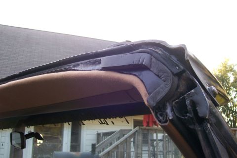 1988 Ford Bronco - The seal and padding are visible on the edge of a vehicle's T-top panel.