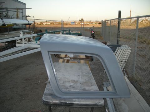 1991 Ford Bronco - A vehicle hardtop, primed and ready for paint, is displayed outdoors.