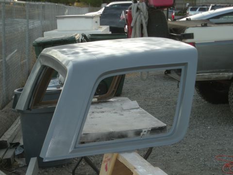 1991 Ford Bronco - This is a primer-gray hardtop for a Ford Bronco, likely undergoing restoration or repair.