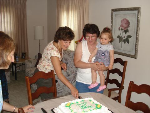 2000 Ford Crown Victoria - A family celebration with a cake and loved ones.