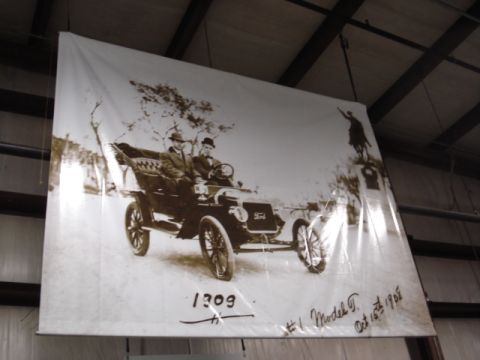 1909 Ford Model T - A vintage Ford Model T, identified as #1 Model T from Oct 15th, 1908, is depicted with two occupants.