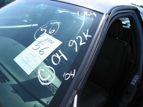 2001 Ford Crown Victoria - Handwritten markings on a car's windshield indicate '04' and '92K', suggesting a 2004 model year.