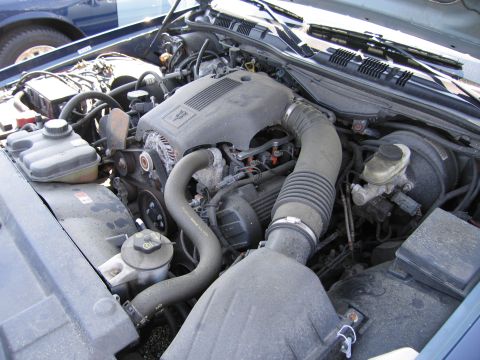 2001 Ford Crown Victoria - The engine bay of a 2001 Ford Crown Victoria is visible, with the hood open.