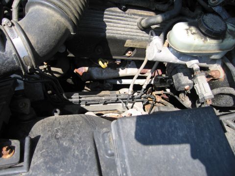 2001 Ford Crown Victoria - Close-up view of an engine bay, showing various mechanical parts and wiring.