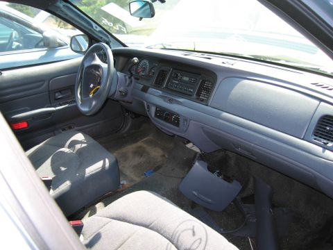 2001 Ford Crown Victoria - Interior view of a 2001 Ford Crown Victoria, dashboard and seats visible.
