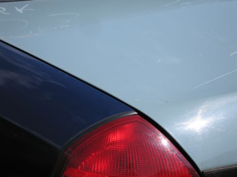 2001 Ford Crown Victoria - Rear corner of a car, showing the taillight and trunk lid detail.