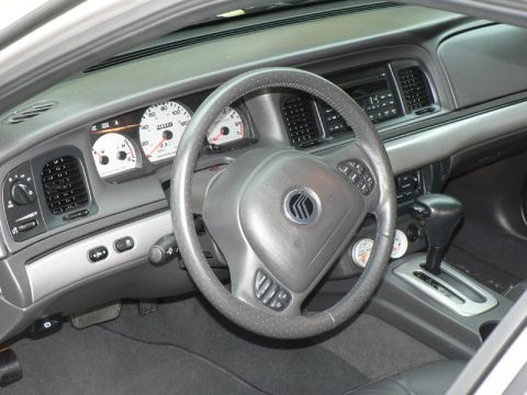 2004 Mercury Marauder - The interior of a 2004 Mercury Marauder features a leather-wrapped steering wheel and a clean dashboard layout.